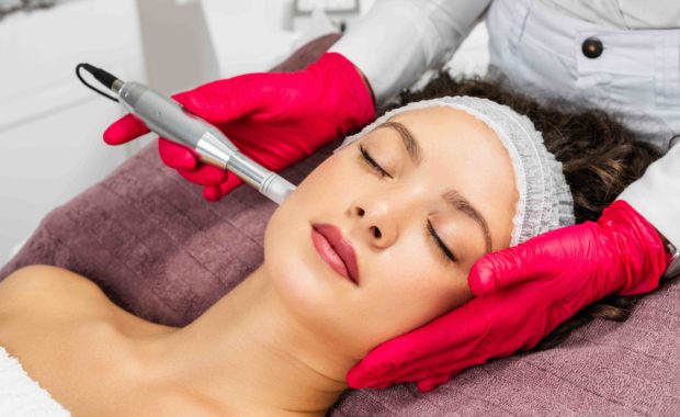 woman receiving microneedling
