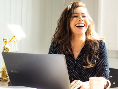 Beautiful Woman smiling behind desk
