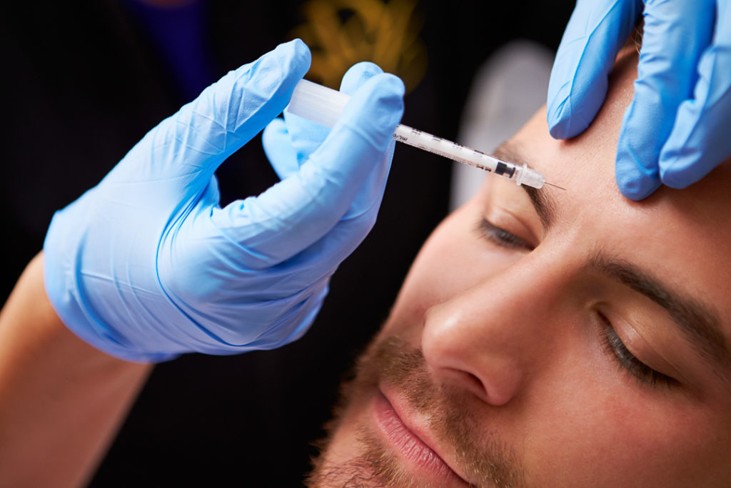 Man Having preventative Botox Treatment At Beauty Clinic