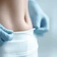 woman's belly recovering after liposuction