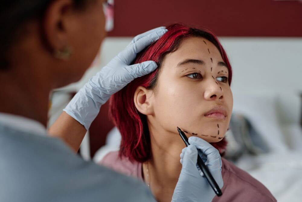 Woman gets markings for cosmetic surgery - Michelle Hardaway M.D.