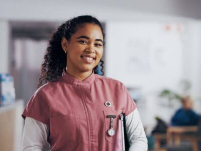 Female nurse in pink scrubs - Michelle Hardaway M.D.