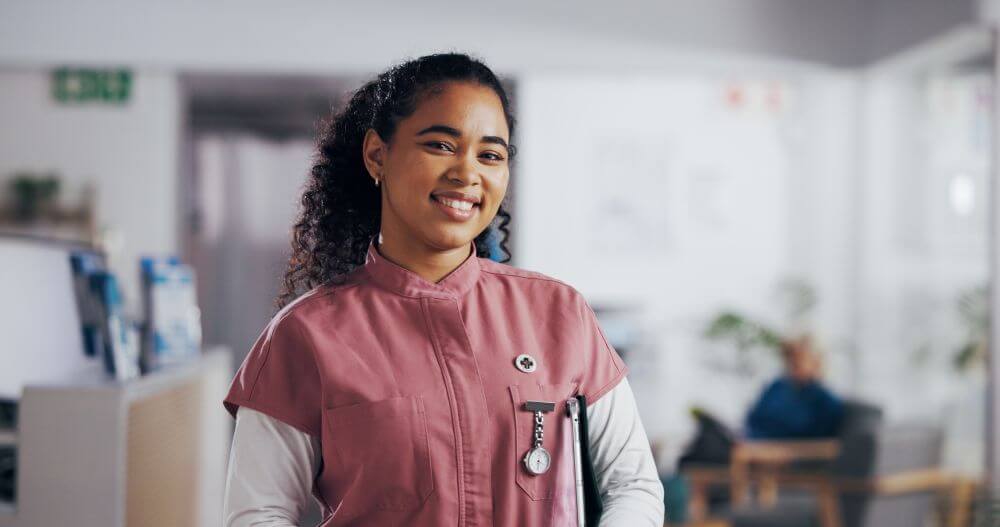 Female nurse in pink scrubs - Michelle Hardaway M.D.