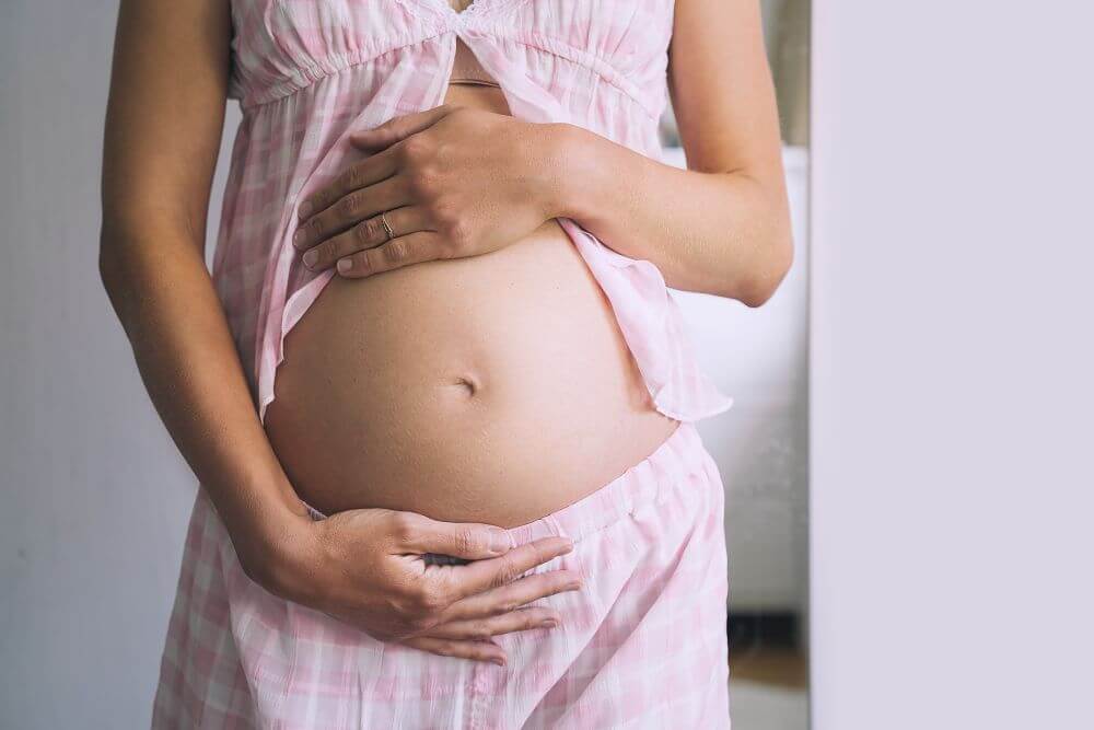 Pregnant woman in pink - Michelle Hardaway