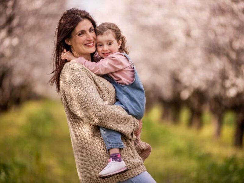 Woman holding a little girl- Michelle Hardaway M.D.