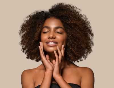 Woman touching her face